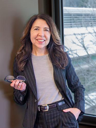 Belén Rodríguez Mourelo stands in an office in the Gaige Building.